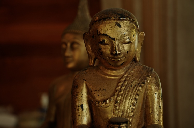 A photo of Buddha images during the cleaning